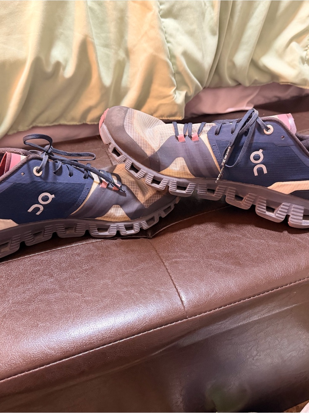 On Running Women’s Athletic Shoes in Navy and Pink Accents